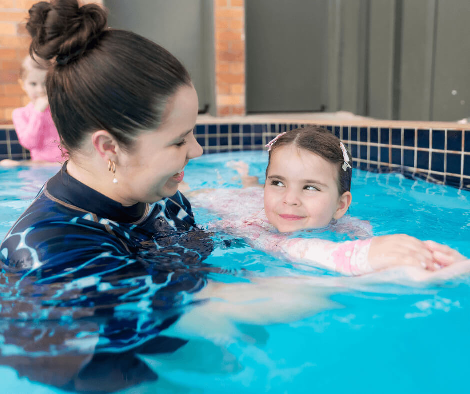 Child building confidence during semi-private swimming lessons.