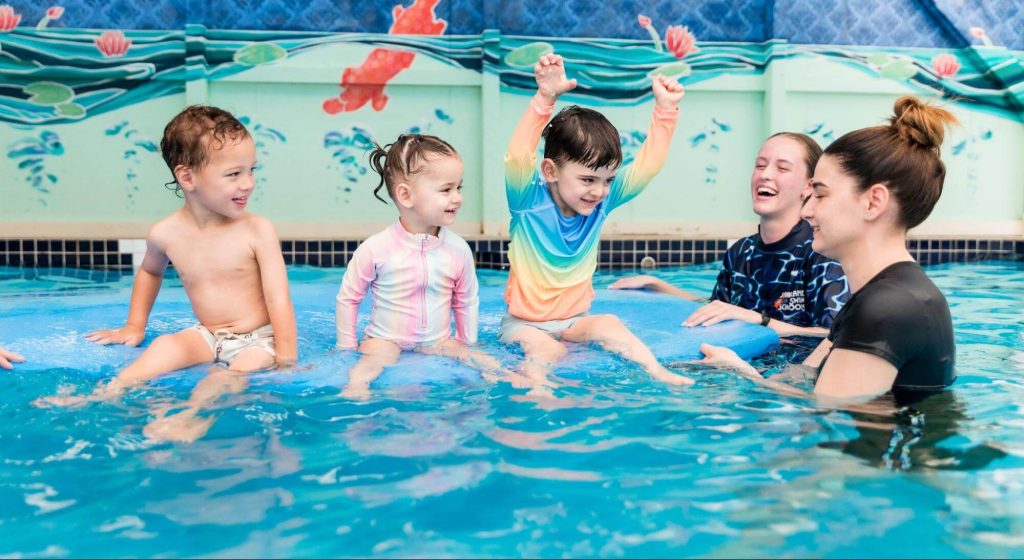 Children gaining confidence in semi-private swimming lessons.